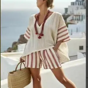 Casual women's summer two-piece V-neck top and striped shorts set in cream and red