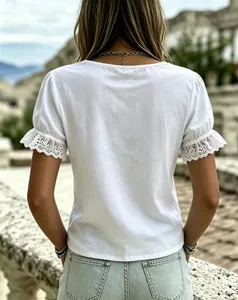 Detailed back view of a white summer cotton t-shirt featuring elegant lace trim sleeves