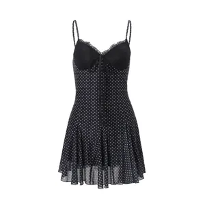 Elegant and sexy black polka dot mini dress with lace trim and tie-front detail for summer