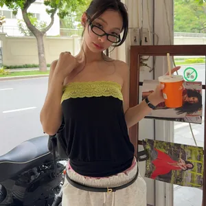 Asian model showcasing a black and lime green lace tube top with street style fashion