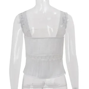 Detail view of a white slim-fit crop top with elegant lace straps and back design.