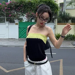 Fashionable street style tube top with black bodice and intricate yellow lace trim detailing