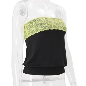 Detail view of black strapless tube top with yellow lace trim on clear mannequin