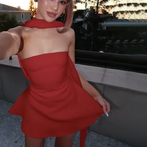 Elegant red strapless French style mini dress featuring a chic matching neck ribbon
