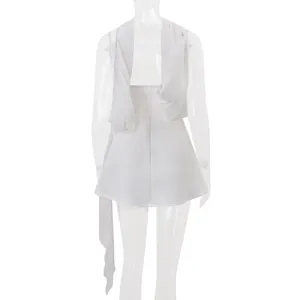 Back view of a chic white French-style mini dress with elegant draping streamers