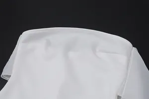 Close-up of the elegant white strapless neckline and premium fabric texture
