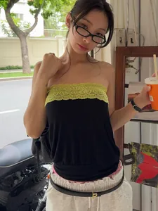 Fashionable street style black tube top with vibrant yellow lace trim for trendy summer wear