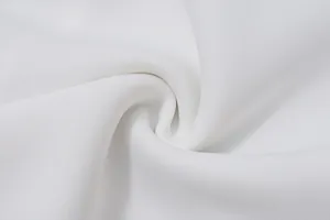 High-resolution macro detail of soft white woven fabric texture for French style dress