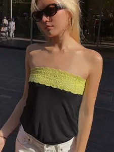 Fashionable street style black tube top with vibrant yellow lace trim for summer