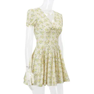 Side view of a vintage floral V-neck mini dress with puff sleeves on a mannequin.