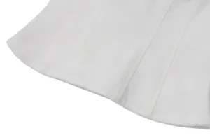 Macro close-up detail of white corset top with delicate lace trim and vertical seams
