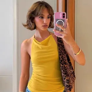 Close-up view of a sexy yellow backless halter neck top for chic summer fashion styling