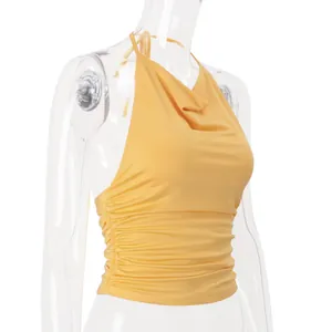 Detailed side view of a yellow ruched halter neck backless crop top for women 2026