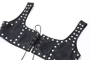 Close-up detail of a black faux leather vest featuring silver rivets and a front lace-up tie