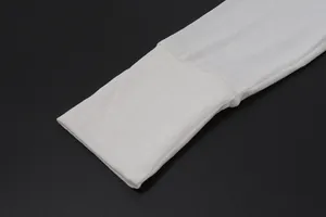 Macro view showing the soft fabric and cuff detail of a white slim-fit knitted cardigan