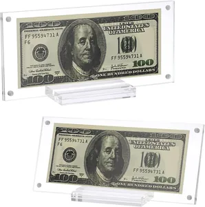 Close-up of clear acrylic currency display frames showing a $100 bill inside each