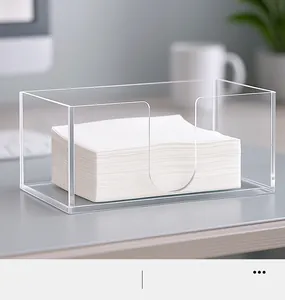 Clear acrylic rectangular napkin holder with U-shaped slot on modern office desk