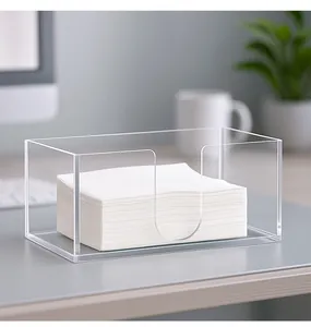 Detailed macro view of a clear acrylic tissue box featuring a U-shaped opening design.