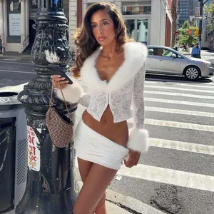 Street style view of white lace top with faux fur collar and matching mini skirt
