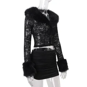 Black lace long sleeve top with faux fur trim and matching mini skirt on mannequin