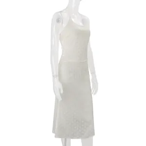 Side view detail of white polka dot satin camisole top and matching midi skirt set
