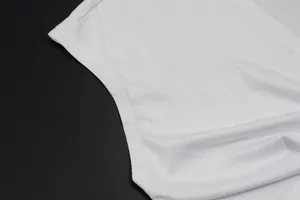 Close-up of high-quality white knit fabric and durable stitching on shrug