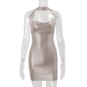 Close-up of champagne gold metallic sequined halter bodycon mini dress with grid texture