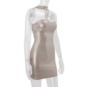 Detailed side view of a metallic silver sequined halter bodycon mini dress on mannequin