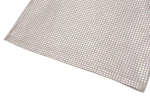 Macro view of metallic silver square sequin fabric with high-quality edge stitching