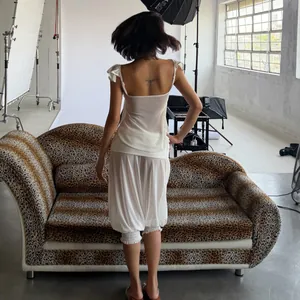 Franse stijl witte mesh top met vlindermouwen en set met lantaarnbroek met hoge taille