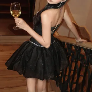 Close-up of a sparkling black strapless mini dress, perfect for an elegant birthday party