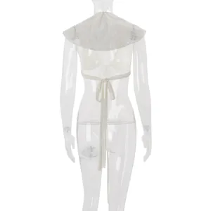 Back view detail of white hollow-out crochet top with ruffle sleeves and lace-up bow tie