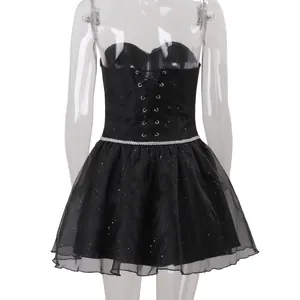Detailed view of black sparkly tube top dress with rhinestone belt and tutu skirt