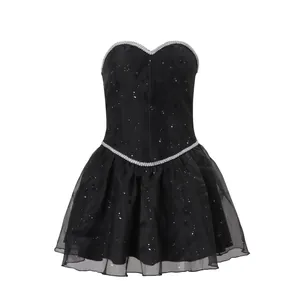 Elegant black strapless mini dress with glitter mesh skirt and silver trim details