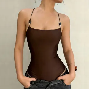 Detailed view of a sexy brown vintage sleeveless bodysuit with decorative black bead straps