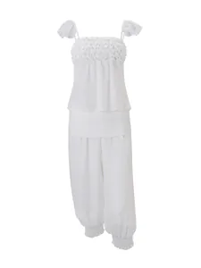 Elegante Franse set met witte top met ruches en harembroek met een hoge taille