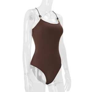 Detailed side view of a brown slim-fit camisole bodysuit on a transparent mannequin.