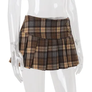 Detail view of brown vintage plaid pleated mini skirt on clear mannequin