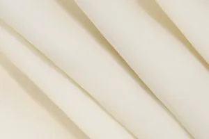 Close-up of soft off-white chiffon fabric showing its delicate texture and elegant folds
