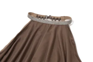 Close-up detail showing the sparkly silver strap and neckline of a brown halter neck dress