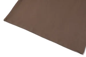 Detail view of the neat double-needle stitching on the hem of a brown jersey dress