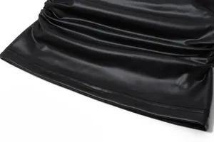 Close-up of black PU leather fabric with ruffled design and high-quality stitching