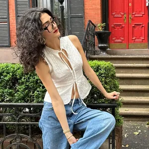 White sleeveless tie-front crop top with eyelet detail for summer street style