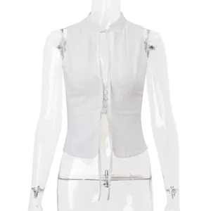 Front view of a white eyelet embroidered cropped vest featuring a tie-front and buttons