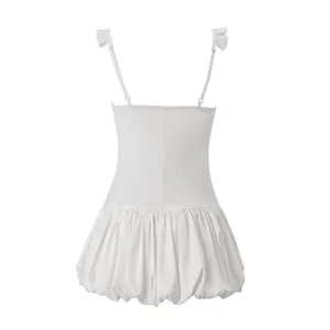 Back view of white summer mini dress with ruffled shoulder straps and bubble hem puffed skirt