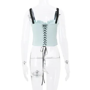Detailed back view of a light blue lace-up corset top with black lace straps