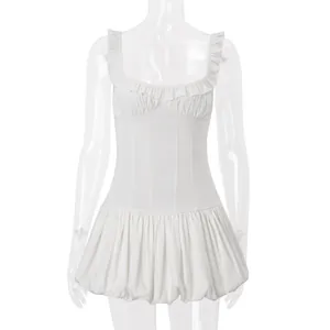 Detailed macro view of a white low-cut pleated puffed dress with ruffled neckline