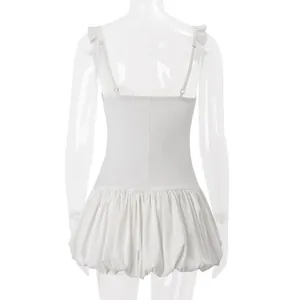 Back view of a white bubble hem mini dress with elegant ruffle straps on a mannequin