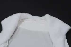Close-up detail of the elegant white faux fur collar on a stylish summer shawl top
