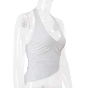 White ruched halter neck top with irregular hem shown from a side angle on a clear mannequin